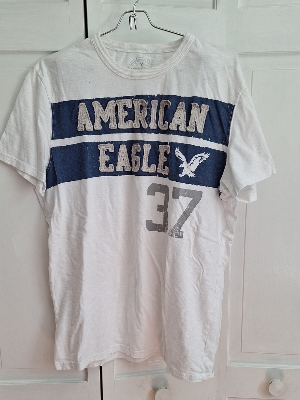 American Eagle Outfitters White Tee with Navy Chest Stripe and Grey Graphic